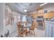 Bright kitchen with wood cabinets, stainless steel appliances and breakfast nook at 5001 Ray Frank Blvd, Pahrump, NV 89060