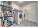 Laundry room with washer, dryer, and ample storage at 5001 Ray Frank Blvd, Pahrump, NV 89060