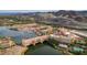 Breathtaking aerial view showcasing the community, with a bridge and water feature, set against a backdrop of mountains at 51 Avenida Sorrento, Henderson, NV 89011