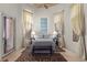 This bedroom has a unique ceiling fan and is decorated with a neutral color scheme, and lots of natural light at 51 Avenida Sorrento, Henderson, NV 89011