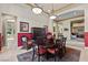 A dining room with a classic rug and a view into the living and sitting rooms at 51 Avenida Sorrento, Henderson, NV 89011