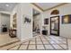 Elegant foyer with decorative tile flooring, arched doorway, and views into the living spaces, creating an inviting atmosphere at 51 Avenida Sorrento, Henderson, NV 89011