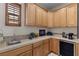 Convenient laundry room features a sink, ample counter space, and built-in cabinetry at 51 Avenida Sorrento, Henderson, NV 89011