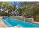 A contemporary pool with a unique water feature wall, providing a relaxing and luxurious outdoor space at 51 Avenida Sorrento, Henderson, NV 89011