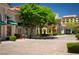 Charming pedestrian walkway lined with mature trees and boutique storefronts within the community at 51 Avenida Sorrento, Henderson, NV 89011