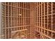 Spacious wine cellar featuring custom wood racking and climate control system at 51 Avenida Sorrento, Henderson, NV 89011