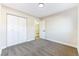 Spacious bedroom with neutral walls, carpet flooring, and double door closet at 5153 Woodruff Pl, Las Vegas, NV 89120