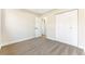 Spacious bedroom with neutral walls, carpet, and a large closet at 5153 Woodruff Pl, Las Vegas, NV 89120