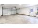 Clean and spacious garage with automatic garage door and extra storage at 5153 Woodruff Pl, Las Vegas, NV 89120