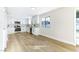 Modern white kitchen with stainless steel appliances and quartz countertops at 5153 Woodruff Pl, Las Vegas, NV 89120