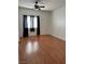 Bright bedroom with hardwood floors and ceiling fan at 5751 E Hacienda Ave # 114, Las Vegas, NV 89122