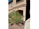 Building exterior with well-maintained landscaping at 5751 E Hacienda Ave # 114, Las Vegas, NV 89122