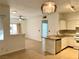 Open kitchen with granite island and a view into the living room at 5751 E Hacienda Ave # 114, Las Vegas, NV 89122