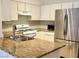 Kitchen features granite countertops and stainless steel appliances at 5751 E Hacienda Ave # 114, Las Vegas, NV 89122