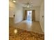 Spacious living area with tile floors and access to patio at 5751 E Hacienda Ave # 114, Las Vegas, NV 89122