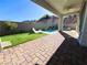 Inviting backyard with a pool, artificial turf, lounge chairs and paved patio at 6 Lilla Rosa St, Henderson, NV 89011