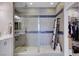 Bathroom shower featuring decorative tiling with a glass door and a towel ladder at 6 Lilla Rosa St, Henderson, NV 89011