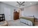 Bedroom features a ceiling fan, neutral walls, and carpet at 6 Lilla Rosa St, Henderson, NV 89011