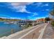 Beautiful community lake view with boats and docks on a sunny day with blue skies at 6 Lilla Rosa St, Henderson, NV 89011