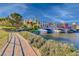 Beautiful lakeside view of a charming, colorful community with an arched bridge at 6 Lilla Rosa St, Henderson, NV 89011