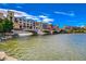 Beautiful waterfront buildings offer stunning architecture and vibrant colors against a bright blue sky at 6 Lilla Rosa St, Henderson, NV 89011