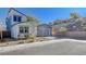 Exterior view of a well-maintained two-story home with low-maintenance landscaping and a modern design at 6 Lilla Rosa St, Henderson, NV 89011