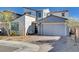 Inviting two-story home featuring a brick driveway and a modern two-car garage at 6 Lilla Rosa St, Henderson, NV 89011