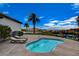 Private hot tub area with lounge chairs provides a relaxing space with palm trees and mountain views at 6 Lilla Rosa St, Henderson, NV 89011