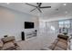 Wide view of the loft, featuring railing, ceiling fan, and comfortable seating area at 6 Lilla Rosa St, Henderson, NV 89011