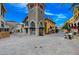 Picturesque shopping center with a mix of stone and stucco buildings and landscaped walkways at 6 Lilla Rosa St, Henderson, NV 89011