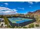 Aerial view of tennis courts, mountain views in the background at 6 Lilla Rosa St, Henderson, NV 89011