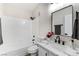 Updated bathroom with white tile, modern vanity, and a bathtub at 601 Harvest Run Dr # 201, Las Vegas, NV 89145