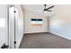 Well-lit bedroom featuring carpet, ceiling fan, and ample closet space at 601 Harvest Run Dr # 201, Las Vegas, NV 89145