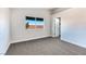 Bright bedroom with carpet flooring, large window, and spacious closet at 601 Harvest Run Dr # 201, Las Vegas, NV 89145