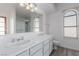 Bathroom with double vanity and large walk-in shower at 6200 Budnick Cir, Las Vegas, NV 89130