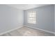 Simple bedroom with light gray walls and wood-look floors at 6200 Budnick Cir, Las Vegas, NV 89130