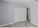 Bedroom with sliding door closet and wood-look floors at 6200 Budnick Cir, Las Vegas, NV 89130