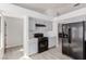 Modern kitchen with gray cabinets and black appliances at 6200 Budnick Cir, Las Vegas, NV 89130