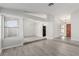 Open living area with vinyl plank flooring and raised dining area at 6200 Budnick Cir, Las Vegas, NV 89130