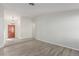 Living room with vinyl flooring and access to entryway and dining area at 6200 Budnick Cir, Las Vegas, NV 89130