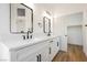 Double vanity bathroom with modern fixtures and mirrors at 6304 Tanzanite Ave, Las Vegas, NV 89130