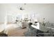 Open concept dining area with contemporary glass table and seating at 6304 Tanzanite Ave, Las Vegas, NV 89130