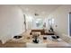 Open concept dining room with rustic wood table, seating, and natural light at 6304 Tanzanite Ave, Las Vegas, NV 89130