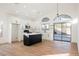 Modern kitchen with island, white cabinets, and access to backyard at 6304 Tanzanite Ave, Las Vegas, NV 89130