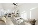 Virtually staged living room with comfortable seating and a large coffee table at 6304 Tanzanite Ave, Las Vegas, NV 89130