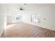 Bright and airy living room with hardwood floors and ceiling fan at 6304 Tanzanite Ave, Las Vegas, NV 89130