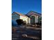 Single-story house with a terracotta tile roof and landscaped front yard at 637 Bay Bridge Dr, North Las Vegas, NV 89032