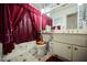 Clean bathroom with a tub, toilet, and vanity at 6513 Hyde Ave, Las Vegas, NV 89107