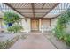 Covered front porch with decorative latticework and a walkway at 6513 Hyde Ave, Las Vegas, NV 89107