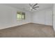 Well-lit bedroom featuring a ceiling fan and ample space at 6692 Radiant Red Ave, Las Vegas, NV 89130